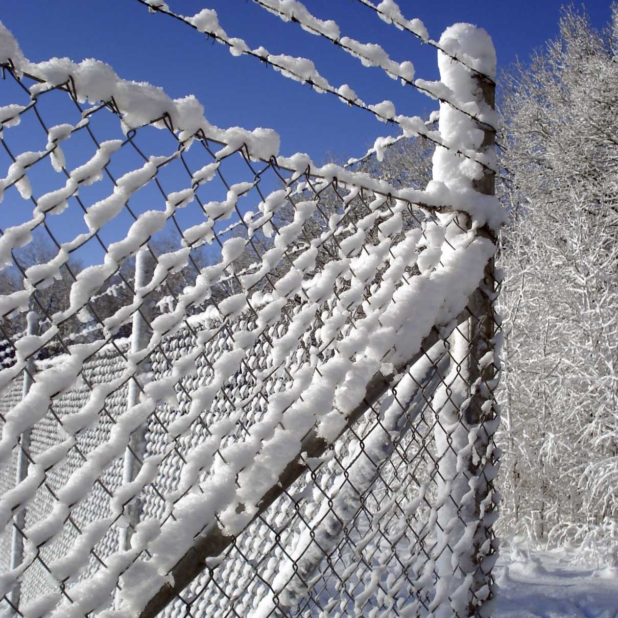 chain link fence netting zinc aluminium used for a fence in the snow